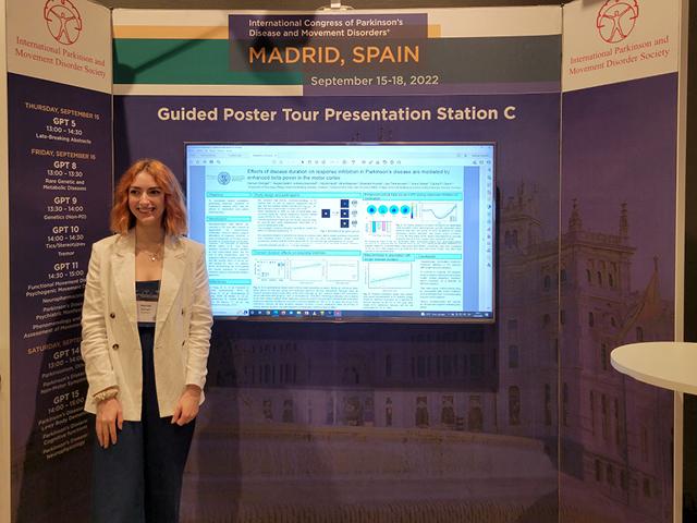A scientist presenting her data a conference